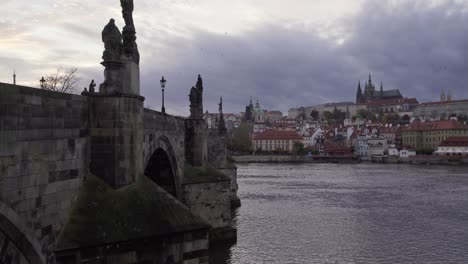 Charles-Bridge-or-Karluv-most-is-popular-tourist-attraction-in-Prague,-Czech-Republic