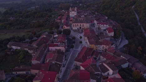 Above-rural-San-Giuliano-del-Sannio-town-during-sunrise-in-Italy,-aerial
