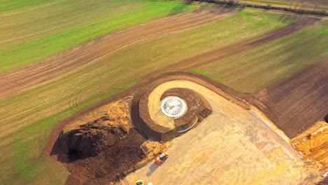 Aerial-Topdown-Of-Constructing-Wind-Turbine-Ground-Foundation-In-A-Field