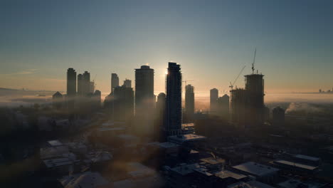 Sunrise-through-the-buildings-and-fog-in-downtown-North-Burnaby