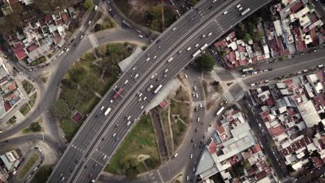 A-stationary-timelapse-aerial-shot-of-heavy-traffic-over-and-under-the-flyover