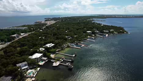 Plantation-key-from-the-sky,-Florida-keys-with-docks-and-ocean-side-buildings