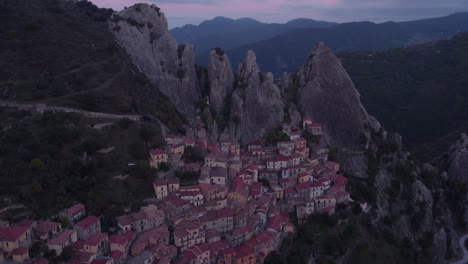 Castelmezzano-most-beautiful-village-in-mountains-of-Italy-at-dawn,-aerial