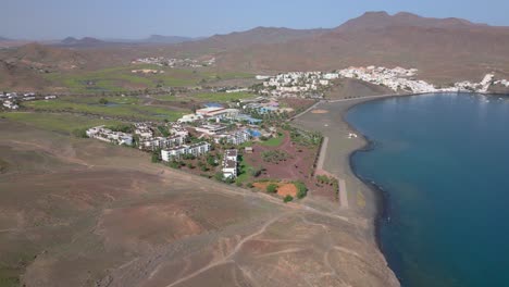 Slow-aerial-approach-of-the-beautiful-Playitas-Resort,-Spain