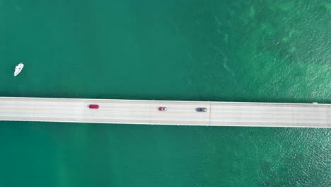 Cars-driving-over-long-bridge-on-overseas-highway-Florida-keys,-Straight-Down-Aerial-View