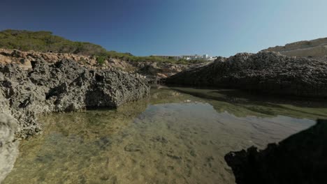 Rock-pool-on-coast-of-Ibiza-island-in-summer-sun