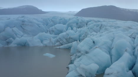 Low-profile-shot-along-the-edge-of-a-glacier