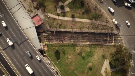 A-dynamic-top-down-aerial-shot-of-construction-workers-working-on-a-railway-system