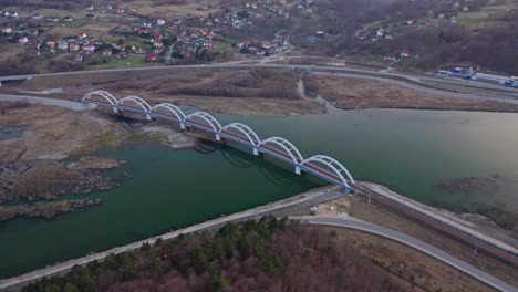 Railway-Arch-Bridge-Over-The-Skawa-River-Within-The-Lake-Mucharskie-In-Poland