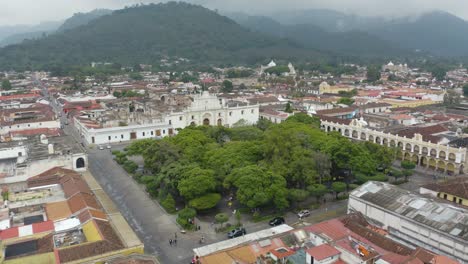 Aerial-view-towards-the-Plaza-Mayor,-Central-Park-and-the-Antigua-Guatemala-Cathedral