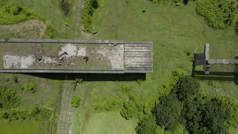 Aerial-shot-of-desolated,-unfinished-bridge-doomed-to-be-destroyed-by-time