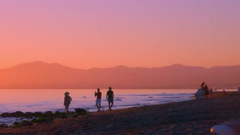 People-at-the-beach-during-sunset
