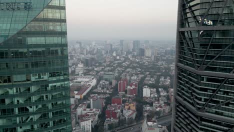 Drone-flying-away-from-the-skyscraper-in-Mexico-City