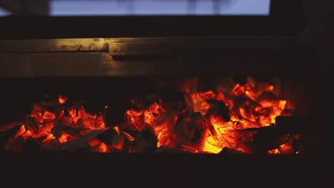 Close-up-coal-and-wood-burning-on-bbq-fire