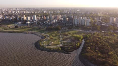 aerial-footage-of-the-coastal-area-of-Olivos-with-the-city-of-Buenos-Aires-in-the-background-at-sunset