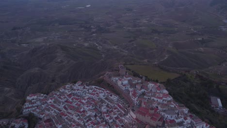 Hill-top-village-Pisticci-in-countryside-of-Basilicata,-Italy,-aerial