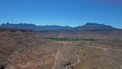 aerial-view-of-Mount-Zion-Mountain-Range-with-road-running-through-it-located-in-Southern-Utah