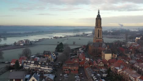 Local-village-church-tower-drone-shot-panorama-from-further-away