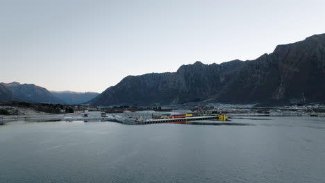 Aerial-over-industrial-dock,-port,-Lofoten,-Norway