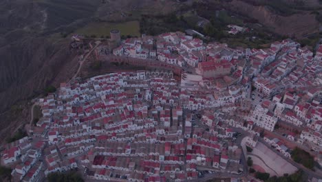 Ancient-hill-top-town-Pisticci-in-southern-rural-Italy,-white-houses,-aerial