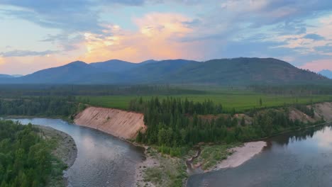 Aerial-Approach-Towards-Confluence-Of-Middle-Fork-And-North-Fork-Of-Flathead-River-At-Sunset-In-Montana
