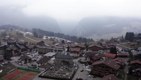 Town-in-misty-snowy-mountains