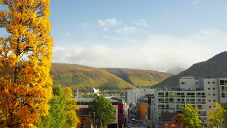 Panning-right-across-Tromso-city-on-coast-of-Norway-in-autumn-season
