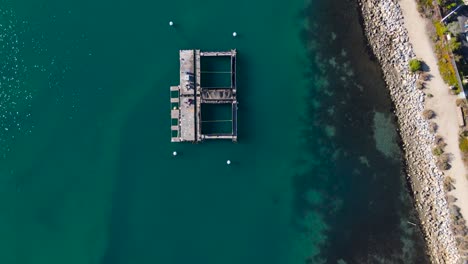 Drone-view-of-fish-hatchery,-Carlsbad-lagoon