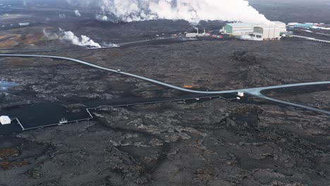 Volcanic-rock-landscape-at-Reykjanes-Power-Station-in-Iceland,-aerial