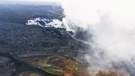 Reykjanes-Electrical-Power-Station-flying-through-thick-white-steam,-aerial