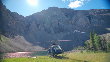 A-thrilling-helicopter-tour-of-the-Canadian-Rocky-Mountains,-breathtaking-aerial-views-of-snow-capped-peaks,-glaciers,-rivers,-and-forests