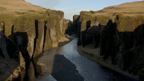 Slow-circling-aerial-shot-looking-down-Fjaðrárgljúfur-canyon-Iceland