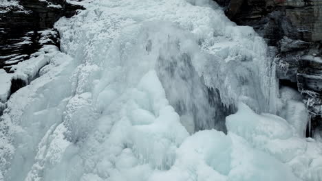 Craggy-Mountain-With-Frozen-Cascades-During-Winter-In-Northern-Norway
