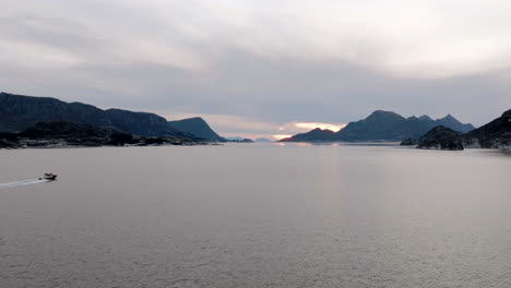 Motorboat,-tourists-drive-through-Lofoten-to-view-a-famous-Fjord