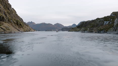 Amazing-drone-flying-low-and-fast-over-Trollfjord,-Lofoten,-Norway