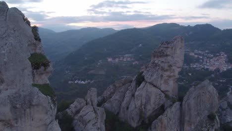 Steep-sharp-rock-formations-of-Dolomiti-Lucane-mountain-range-in-Italy,-aerial