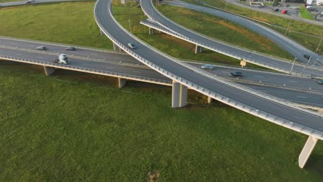 An-aerial-view:-cars-and-trucks-drive-over-the-country-bridge-with-no-traffic
