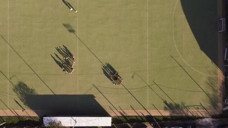 Two-hockey-teams-prepare-for-the-game-on-a-beautiful-green-field-in-Buenos-Aires