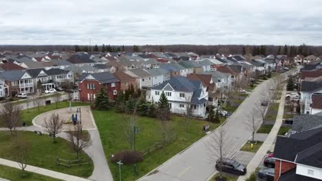 Drone-circling-over-Ajax-neighborhood-near-a-lake-in-the-winter