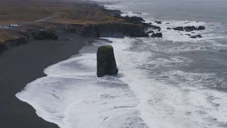 Sea-Stack-Protruding-On-The-Coastline-Of-Black-Sand-Beach-In-Stapavik-In-Eastern-Iceland