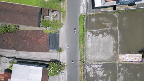 Drone-top-view-of-Indonesian-housing-and-transportation,-Sukowati,-Gianyar,-Bali