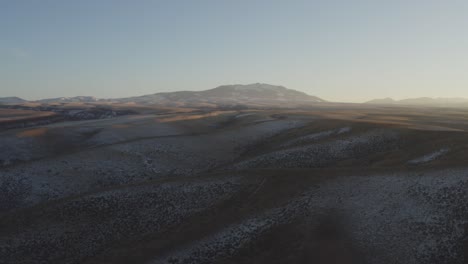 A-drone-flies-over-frozen-hills-in-Rural-Idaho-covered-in-ice