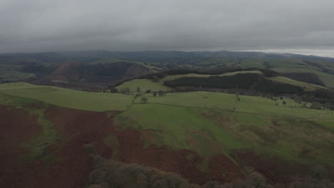 Drone-shot-of-rolling-english-countryside-with-hills-and-fields