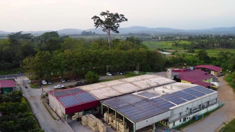 Aerial-view-of-warehouse-with-solar-panels-on-roof-in-rural-Africa
