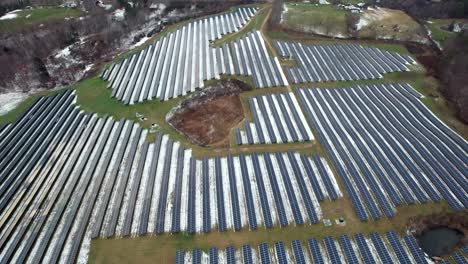 Solar-panel-field-near-Quechee,-Vermont---aerial-flyover