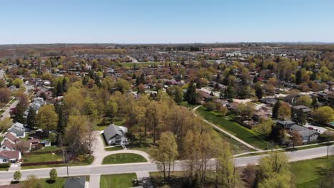 Drone-flying-over-small-Acton-neighborhood-in-the-spring