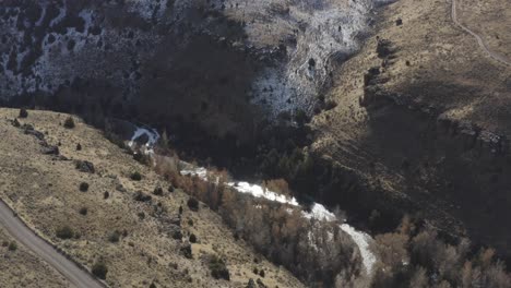 A-drone-lowers-over-a-canyon-in-Rural-Idaho-with-melting-snow