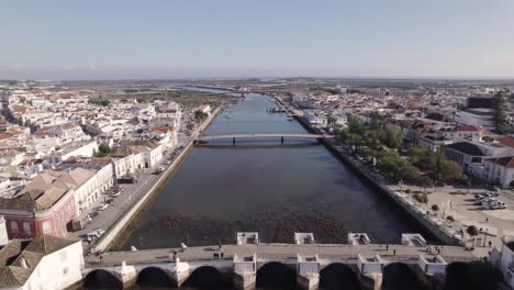 FlyOver-Gilão-RIver-with-people-crossing-Old-Bridge