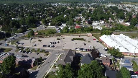 Drone-flying-over-train-station-in-suburban-Acton-neighborhood