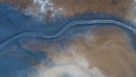 Aerial-View-Of-Blue-Mud-On-Hverir-Geothermal-Area-in-North-Iceland